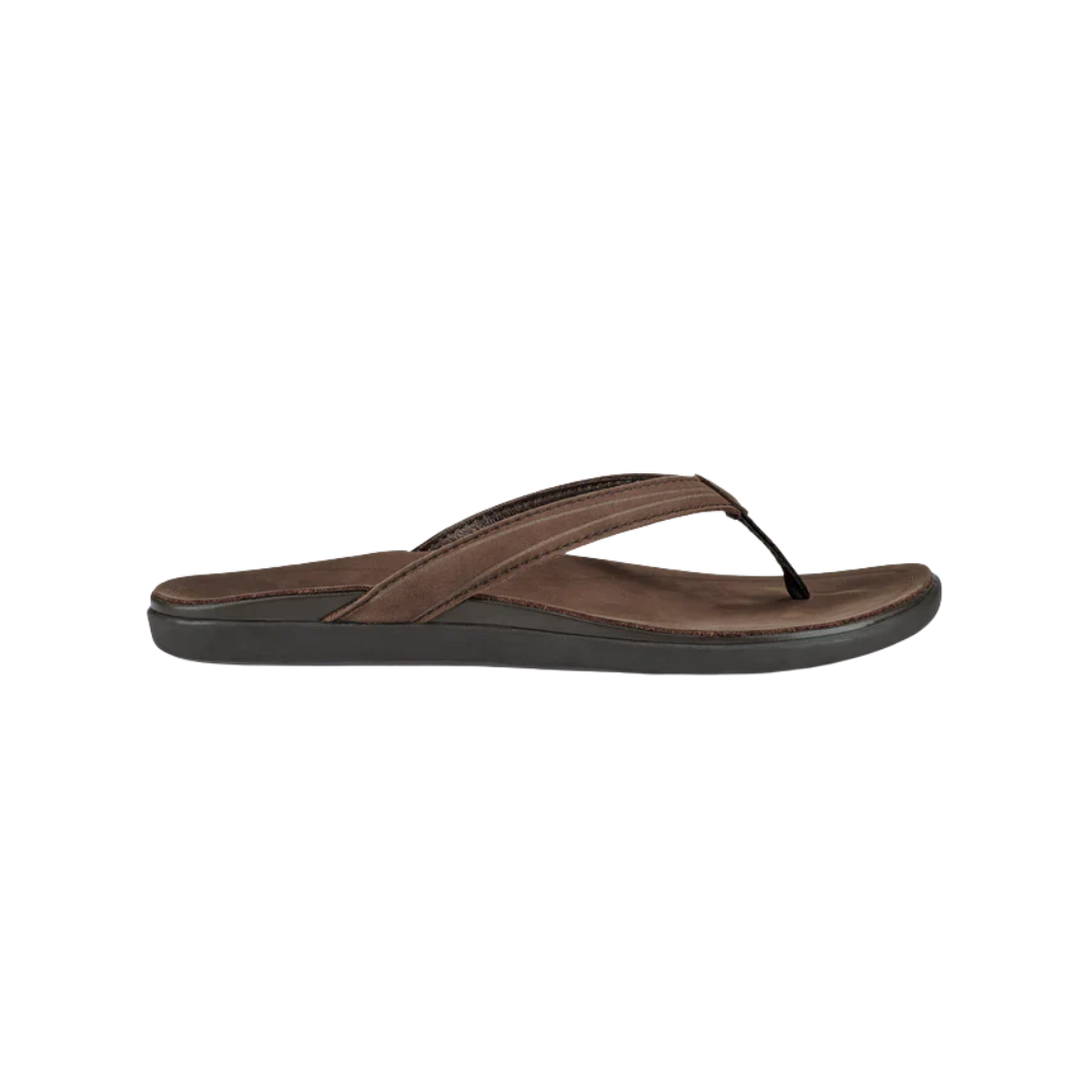 Side view of Women’s Olukai ʻAukai sandal in Dark Java/Dark Java – featuring a sleek, full-grain leather upper, soft microfiber lining, contoured anatomical footbed, and non-marking rubber outsole for refined, everyday comfort.