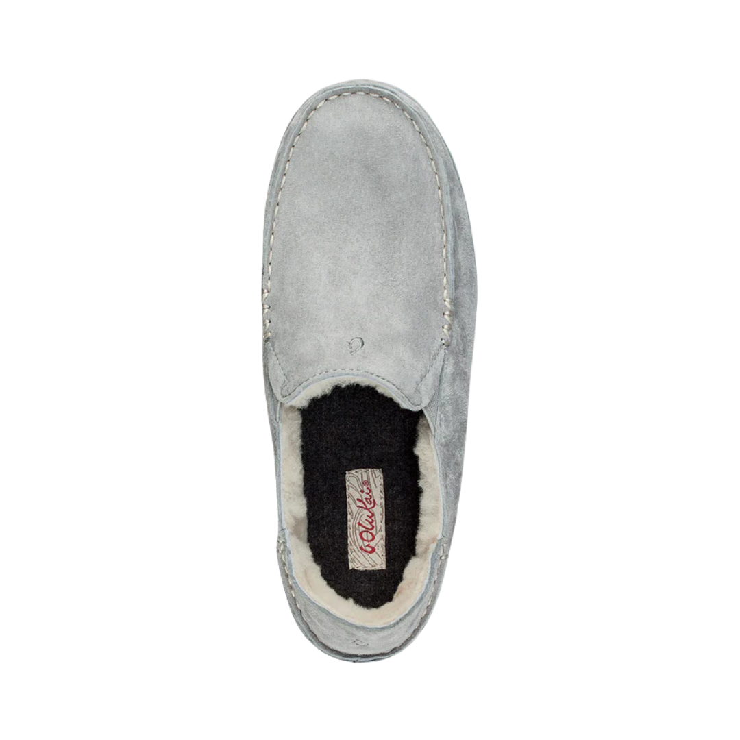 Top View of Women’s Olukai Nohea Slipper in pale grey – featuring a soft shearling lining, water-resistant suede upper, and a durable non-marking rubber outsole for indoor and outdoor comfort.