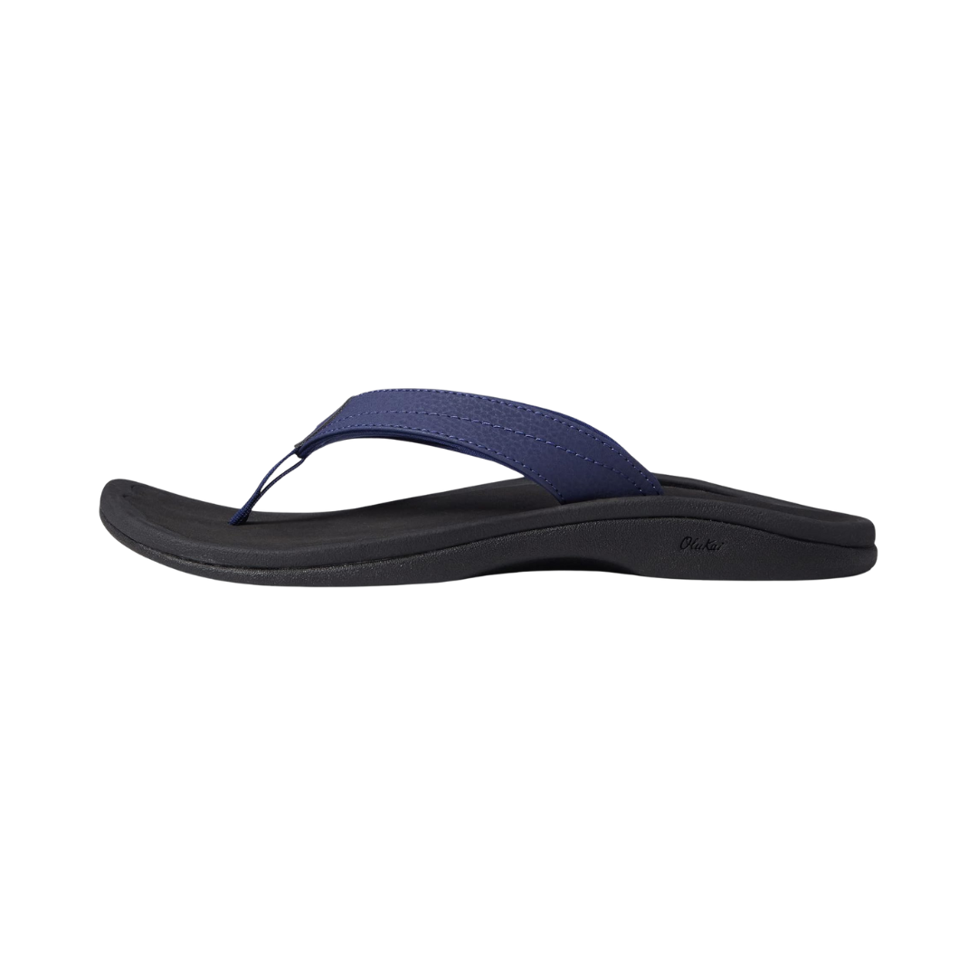 Side view of Olukai Ohana sandal in Pacifica/Black – featuring a water-resistant synthetic strap in deep blue, quick-drying jersey lining, cushioned EVA midsole, and non-marking rubber outsole with wet grip tread for versatile, all-day wear.