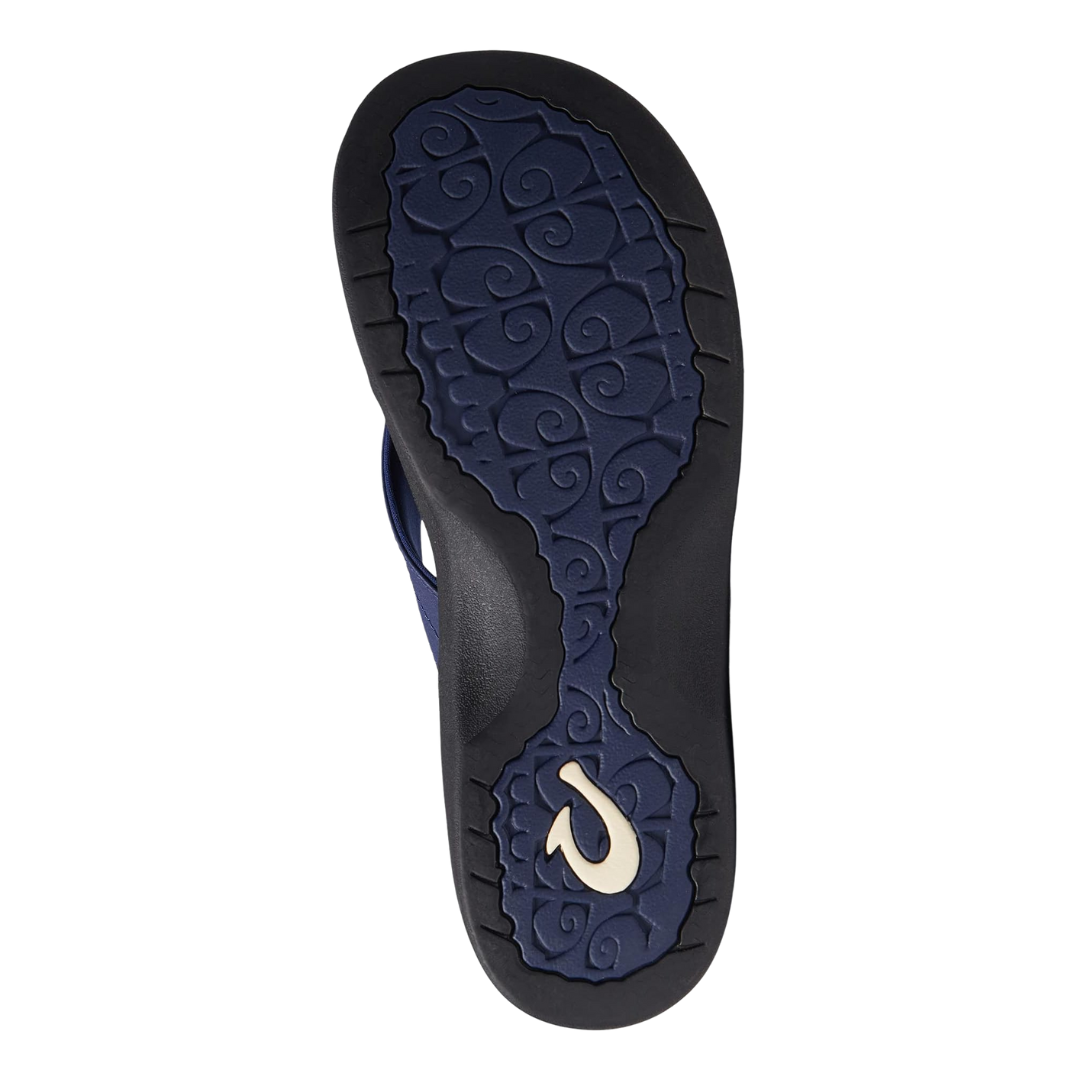 Back view of Olukai Ohana sandal in Pacifica/Black – featuring a gently rounded heel cup, dual-density footbed edge, and clean strap stitching for a lightweight, supportive fit.