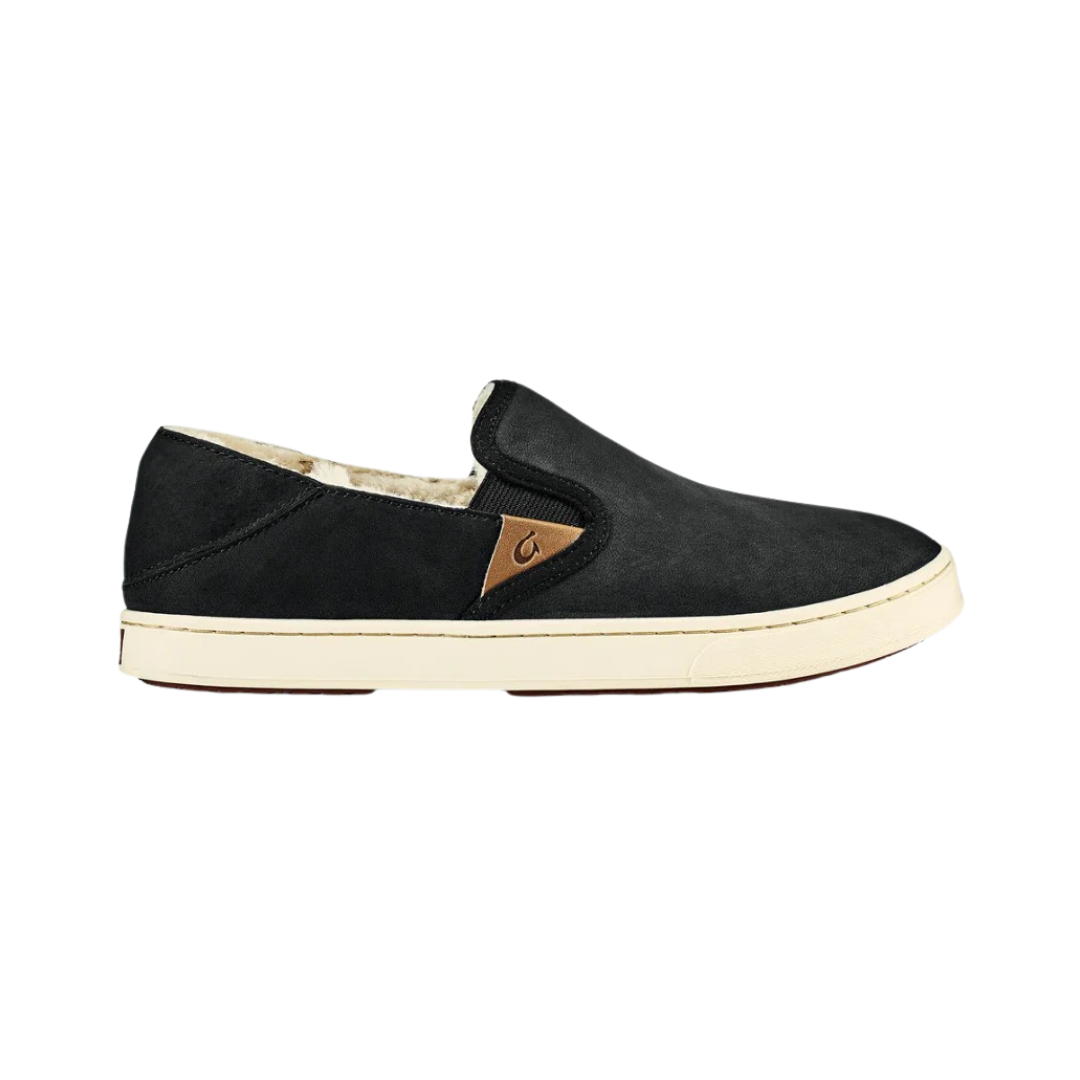 Side View of Women’s Olukai Pehuea Heu slip-on sneaker in lava rock – featuring a soft suede upper, cozy shearling lining, and a flexible non-marking rubber outsole for everyday comfort.