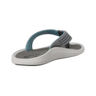 Angled view of Men’s Olukai Ulele sandal in stone – features include a water-friendly synthetic strap, cushioned anatomical footbed, wet grip rubber outsole, and lightweight construction built for both land and water use.