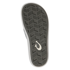 Bottom view of Men’s Olukai Ulele sandal in stone – features include a non-marking rubber outsole with razor siping for enhanced traction on wet surfaces, durable tread pattern, and water-friendly design.
