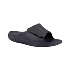 Side view of Men’s Ooahh Sport Flex Sandal in matte black – featuring an adjustable synthetic strap, patented OOfoam™ midsole for 37% more impact absorption than traditional foam, biomechanically designed footbed, and sleek recovery-focused slide profile.