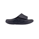 Side view of Men’s Ooahh Sport Flex Sandal in matte black – featuring an adjustable synthetic strap, patented OOfoam™ midsole for 37% more impact absorption than traditional foam, biomechanically designed footbed, and sleek recovery-focused slide profile.