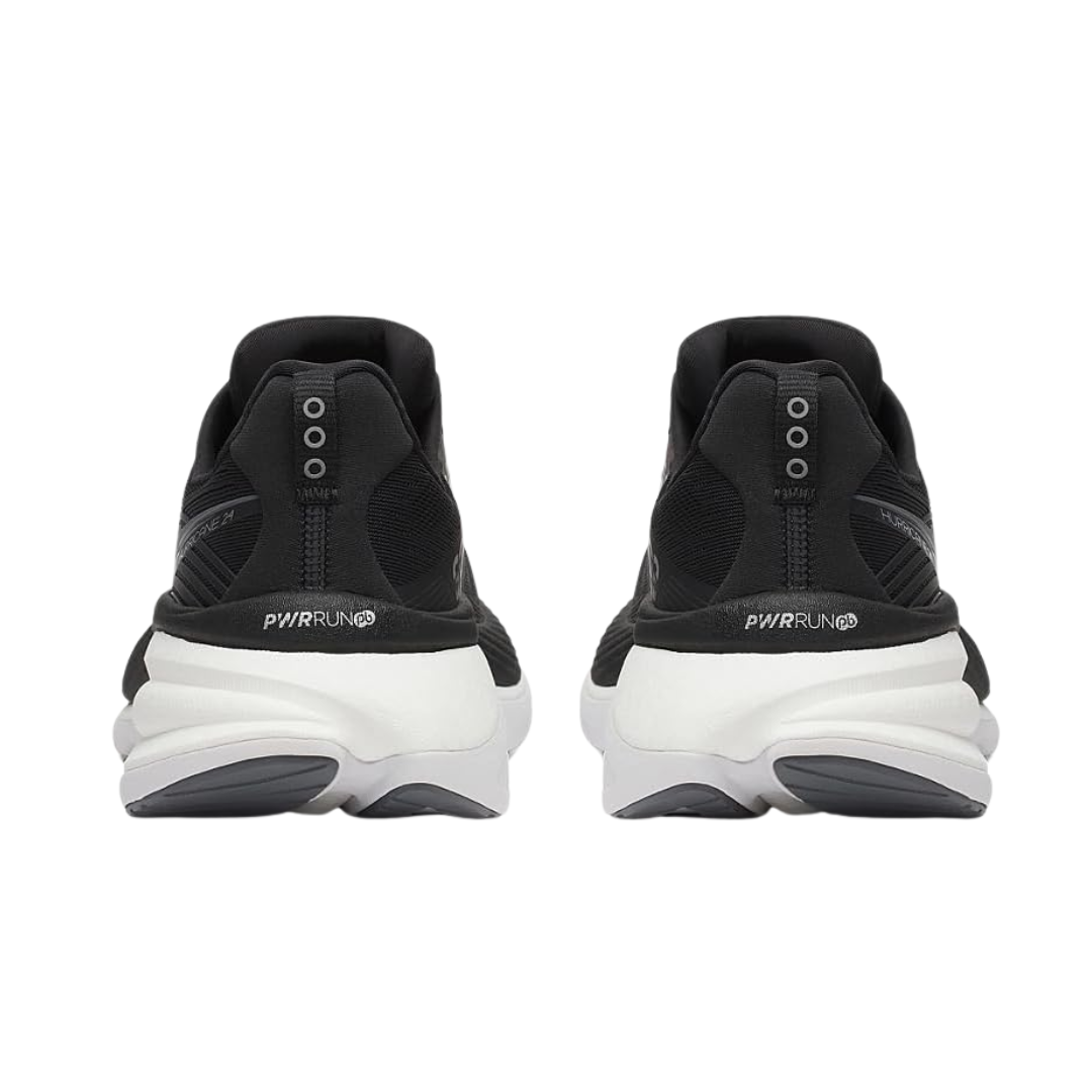 Back view of Men’s Saucony Hurricane 24 in Black/Carbon – featuring a molded heel counter for enhanced rearfoot support, cushioned heel collar, and reflective carbon detailing for visibility and structure.