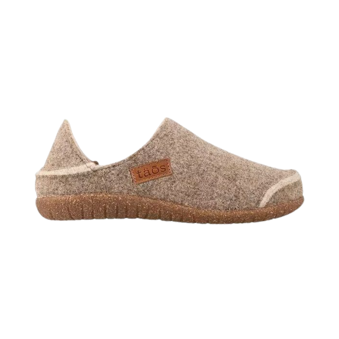 Side View of Women’s Taos Convertawool Shoe in Warm Sand – featuring cozy wool construction, convertible heel for slide-on wear, and cushioned midsole for all-day comfort.