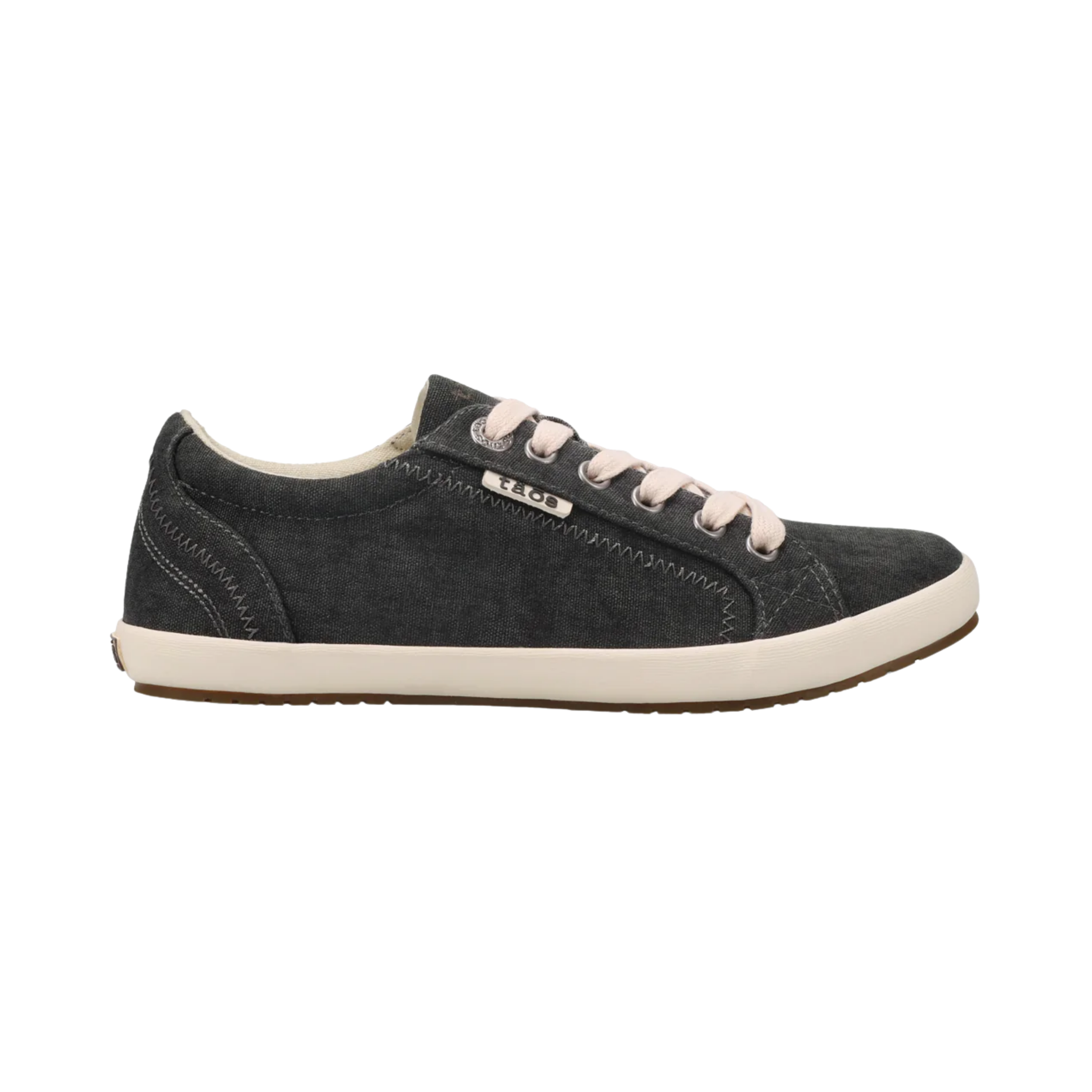 Side View of Women's Taos Star in Charcoal Wash Canvas – Featuring a classic low-top silhouette with a secure and supportive fit, the shoe is designed to provide all-day comfort. The cushioned insole and soft lining ensure that your feet stay comfortable, while the sleek canvas exterior adds an effortless touch of style to any casual outfit.