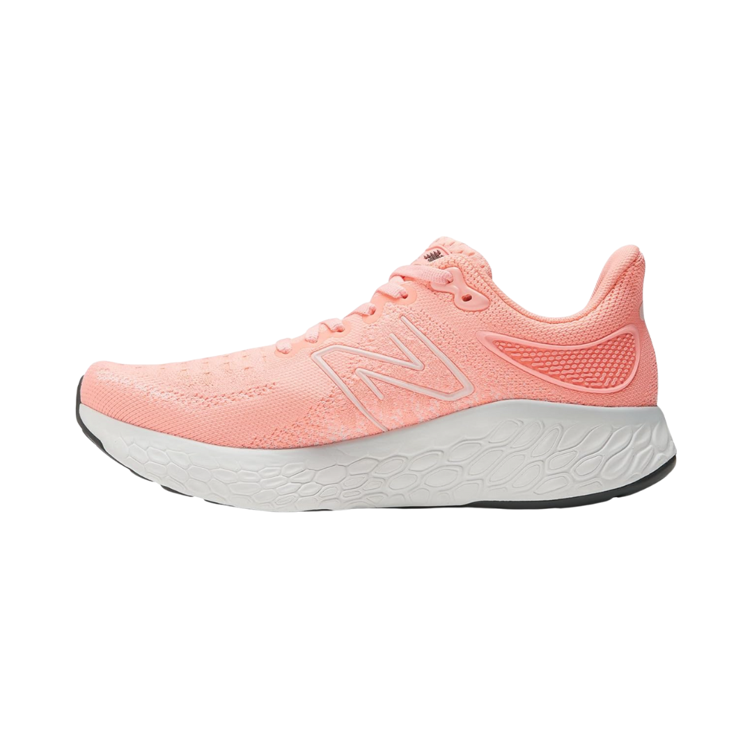 Side View of Women’s New Balance Fresh Foam X 1080v12 running shoe in grapefruit – featuring engineered mesh upper for breathability, Fresh Foam midsole for plush cushioning, and supportive overlays for stability.