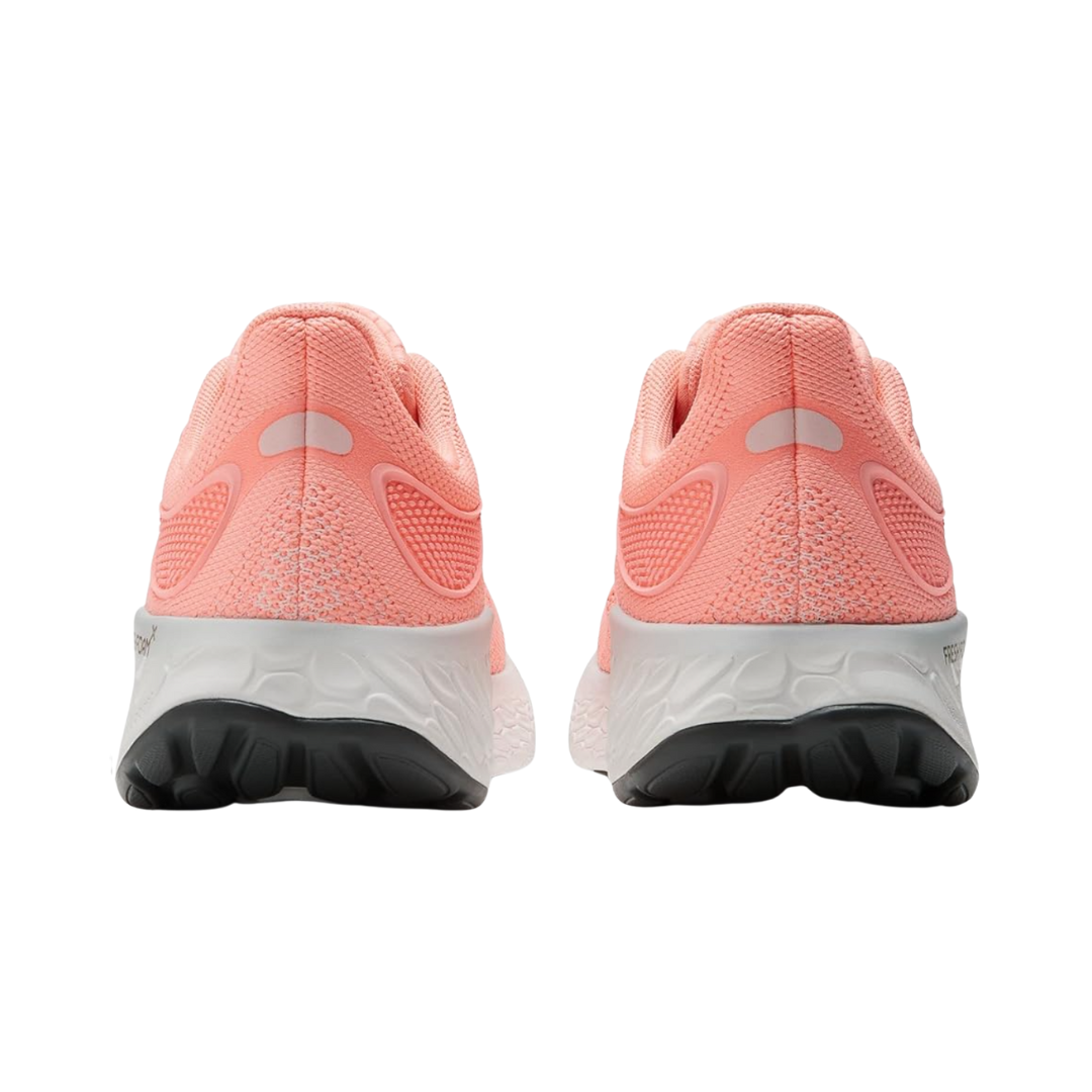 Back View of Women’s New Balance Fresh Foam X 1080v12 running shoe in grapefruit – featuring structured heel counter for support, pull tab for easy on and off, and padded collar for ankle comfort.