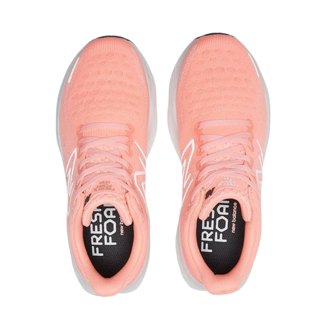 Top View of Women’s New Balance Fresh Foam X 1080v12 running shoe in grapefruit – featuring engineered mesh upper for breathability, Fresh Foam midsole for plush cushioning, and supportive overlays for stability.