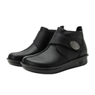 Side View of Women’s Alegria Caiti boot in upgrade black – featuring a cushioned cork and memory foam footbed, side zipper with adjustable buckle strap, and slip-resistant outsole for versatile wear.