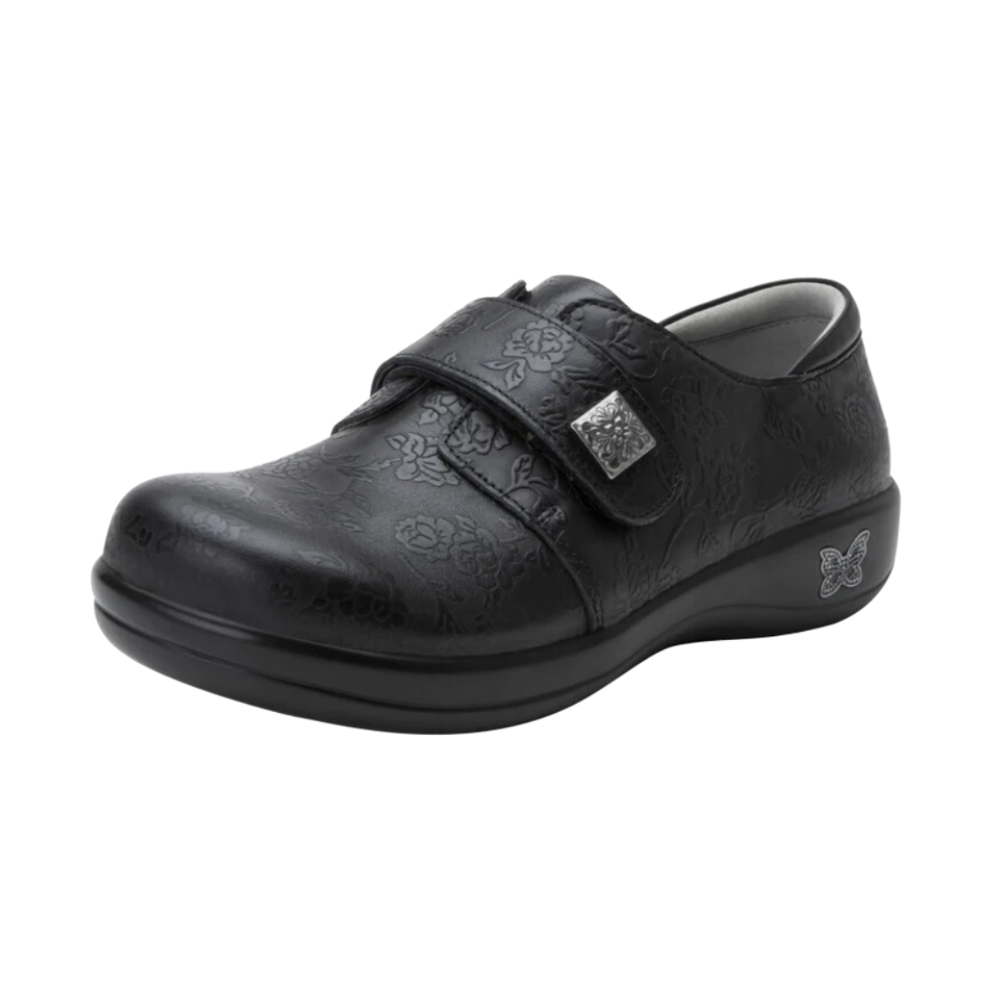 Side View of Women’s Alegria Joleen shoe in Class Act black – featuring a cushioned removable footbed, adjustable hook-and-loop strap, and slip-resistant outsole for lasting comfort.