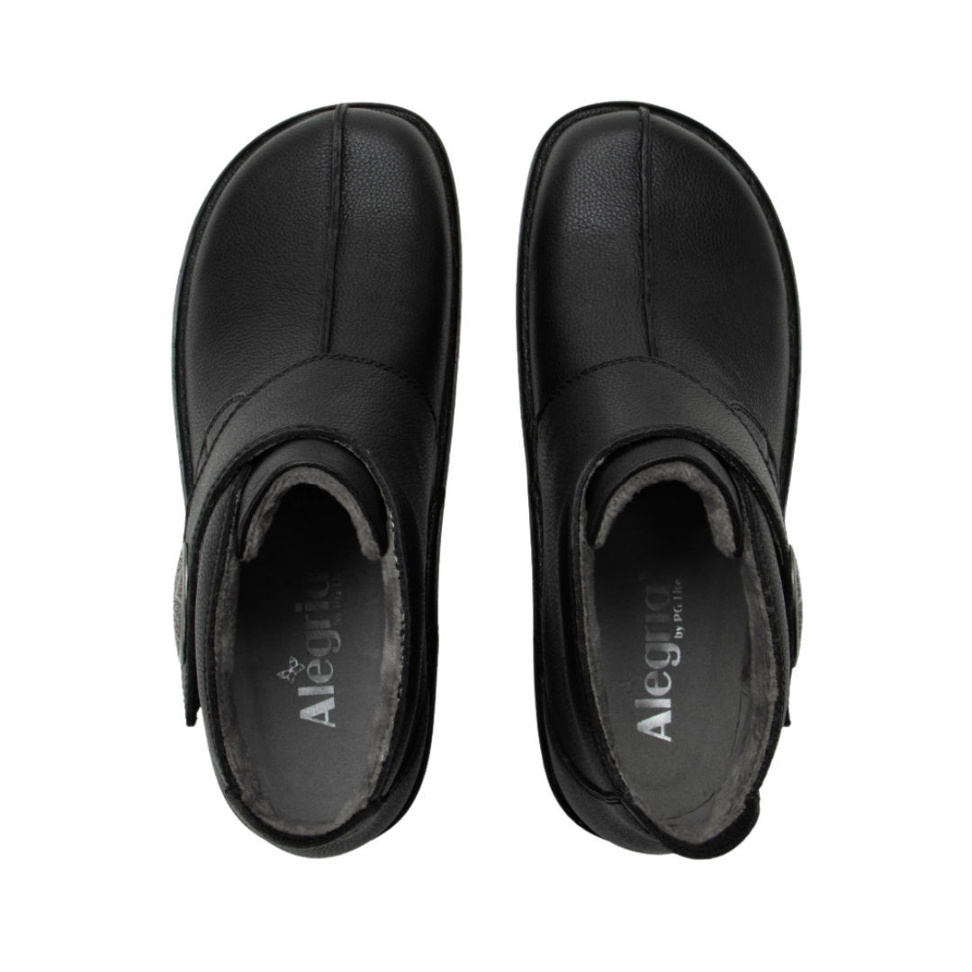 Top View of Women’s Alegria Caiti boot in upgrade black – featuring a cushioned cork and memory foam footbed, smooth leather upper, and adjustable buckle strap for a secure fit.