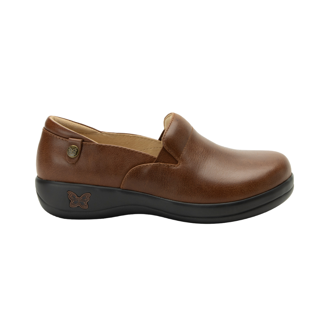 Side View of Women’s Alegria Keli shoe in walnut brown – featuring a cushioned removable footbed, slip-on design, and slip-resistant outsole for all-day support.