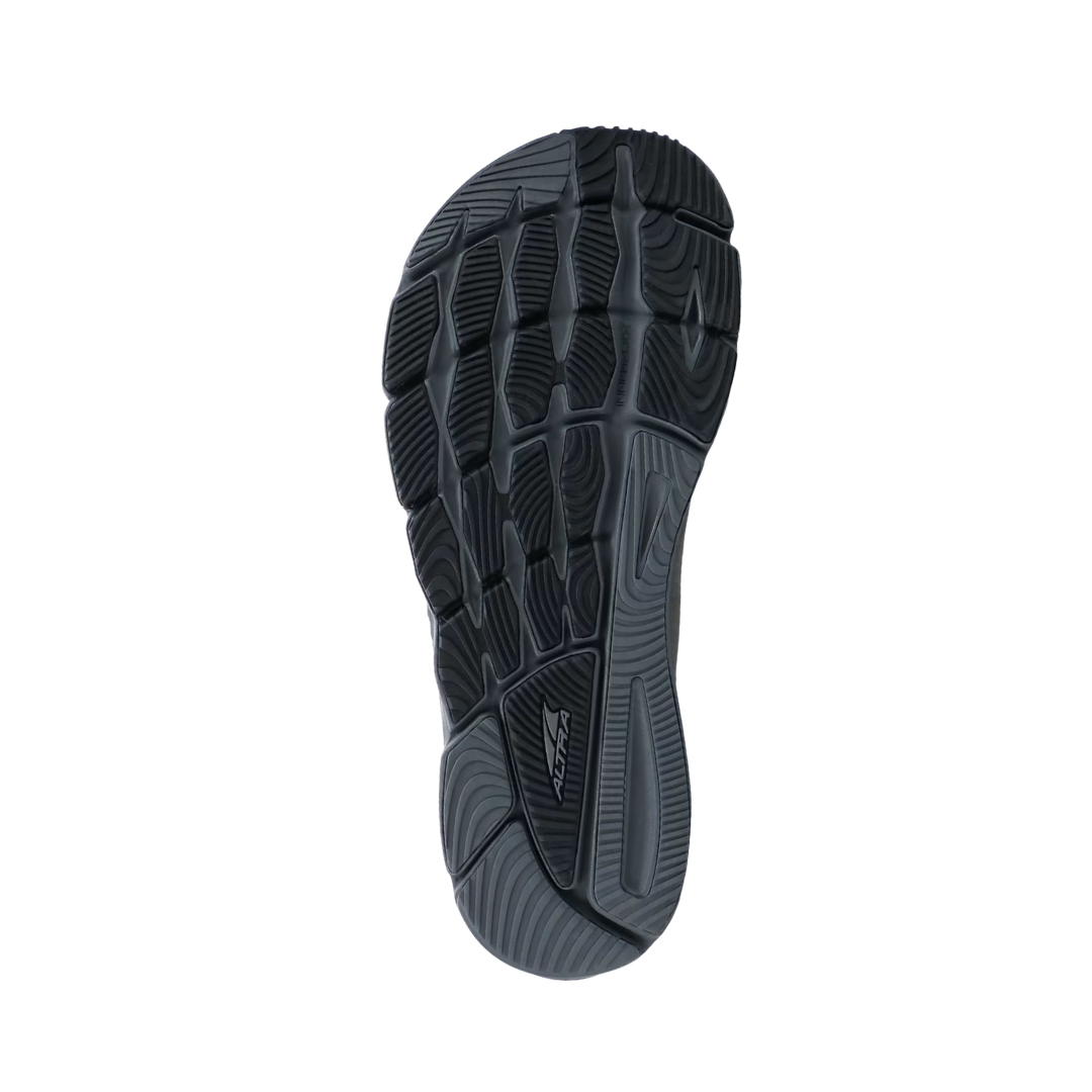 Bottom view of the Men’s Altra Torin 5 Luxe in Dark Gray, showing the durable outsole pattern designed for stability, traction, and balanced alignment. The zero-drop platform and strategic tread layout help promote a natural gait and support low-impact movement for everyday walking.