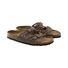 Side View of Women’s Birkenstock Granada Soft Footbed Oiled Leather sandal in tobacco brown – featuring premium oiled leather straps with floral-inspired cutouts and dual adjustable metal buckles, anatomically shaped cork-latex soft footbed with integrated foam layer for enhanced cushioning, deep heel cup and contoured arch support for natural foot positioning, and lightweight EVA outsole for flexibility and everyday comfort.