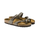 Side View of Women’s Birkenstock Mayari Birkibuc sandal in stone – featuring soft, skin-friendly Birkibuc synthetic upper with toe loop and crisscross strap design, adjustable metal buckles for a personalized fit, anatomically shaped cork-latex footbed with deep heel cup and raised toe bar for natural alignment, and a lightweight EVA outsole for flexibility and shock absorption.