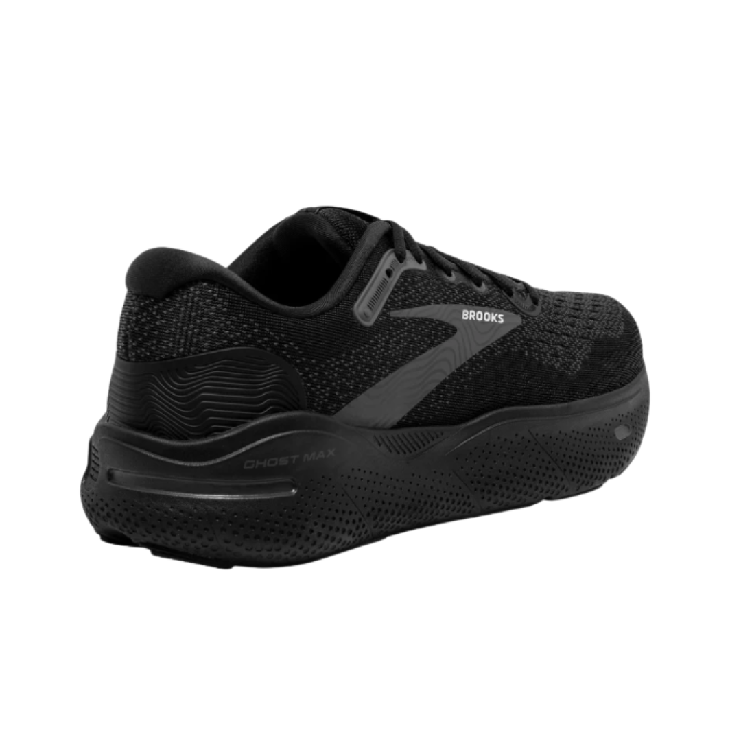 Angled View of Men’s Brooks Ghost Max running shoe in black black ebony – featuring a breathable engineered mesh upper, GlideRoll Rocker for smooth heel-to-toe transitions, and thick cushioned sole for soft, stable support.