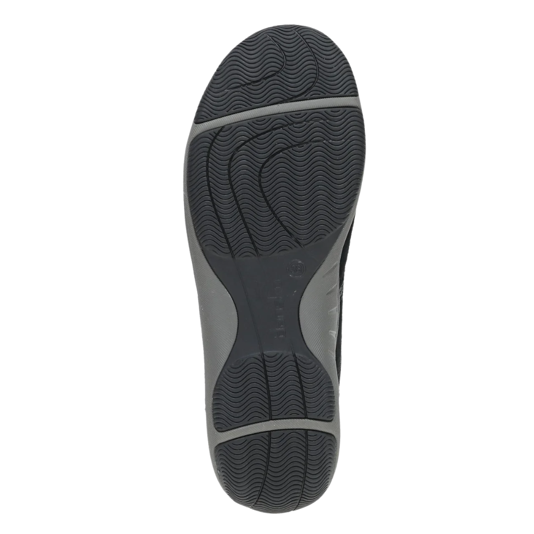 Bottom view of Women’s Dansko Harlyn sneaker in black suede – featuring a flexible rubber outsole, patterned grip zones, and traction-focused tread design.