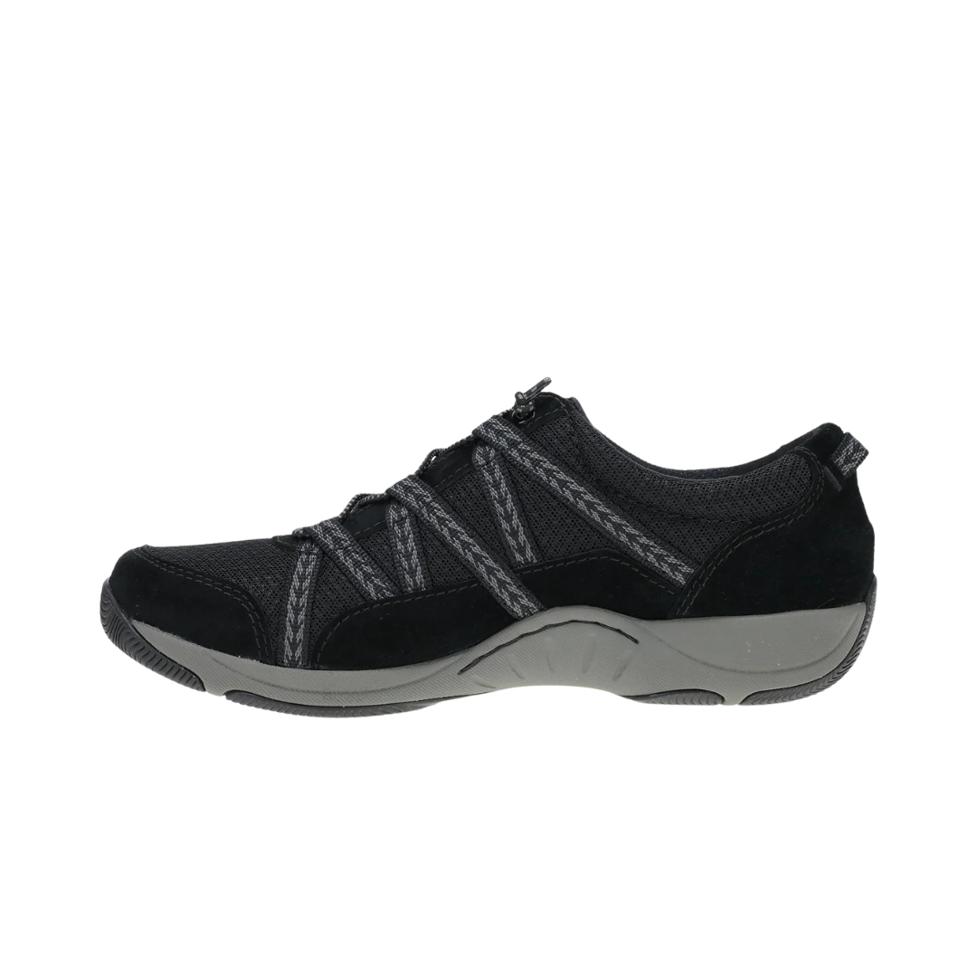 Side view of Women’s Dansko Harlyn sneaker in black suede – featuring a low-profile design, arch-support midsole, and mixed suede and fabric texture.