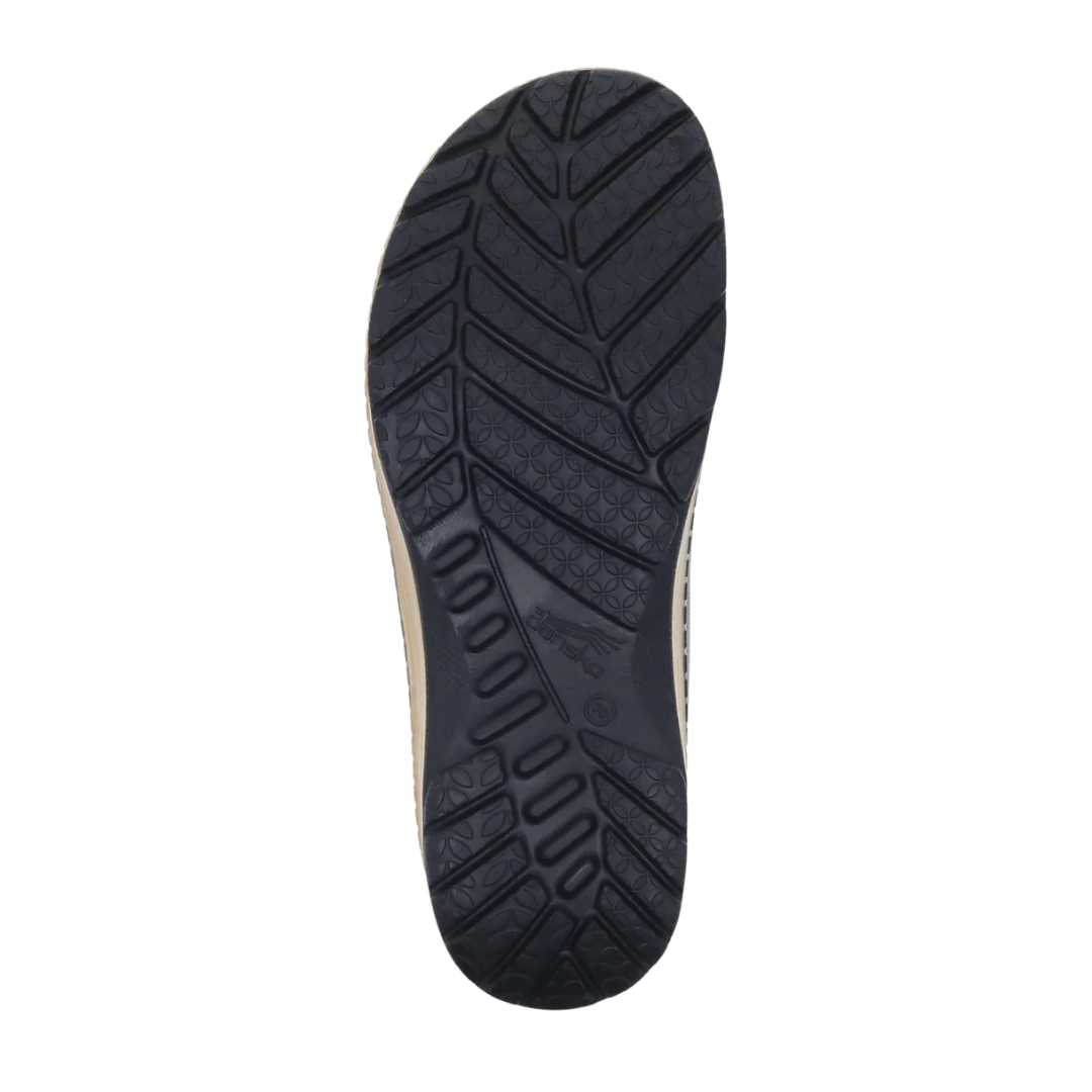 Bottom view of Women’s Dansko Kane molded clog in black – featuring a textured rubber outsole, slip-resistant grip zones, and flexible forefoot design.