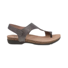 Side view of the Women’s Dansko Reece Sandal in Pewter Metallic, featuring a soft genuine leather upper with an adjustable hook-and-loop strap, a minimalist silhouette, and a lightweight rubber outsole. Designed with Dansko Natural Arch Technology and a molded EVA footbed for all-day support and comfort.