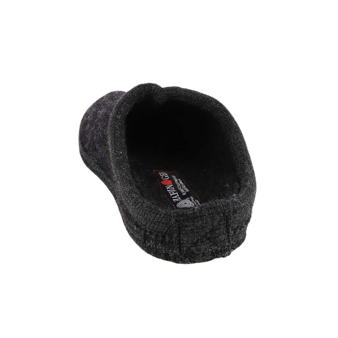 Back view of Haflinger Men's AT in Black – featuring a closed heel design with a subtle rise for secure fit, and reinforced wool stitching for durability and structure.