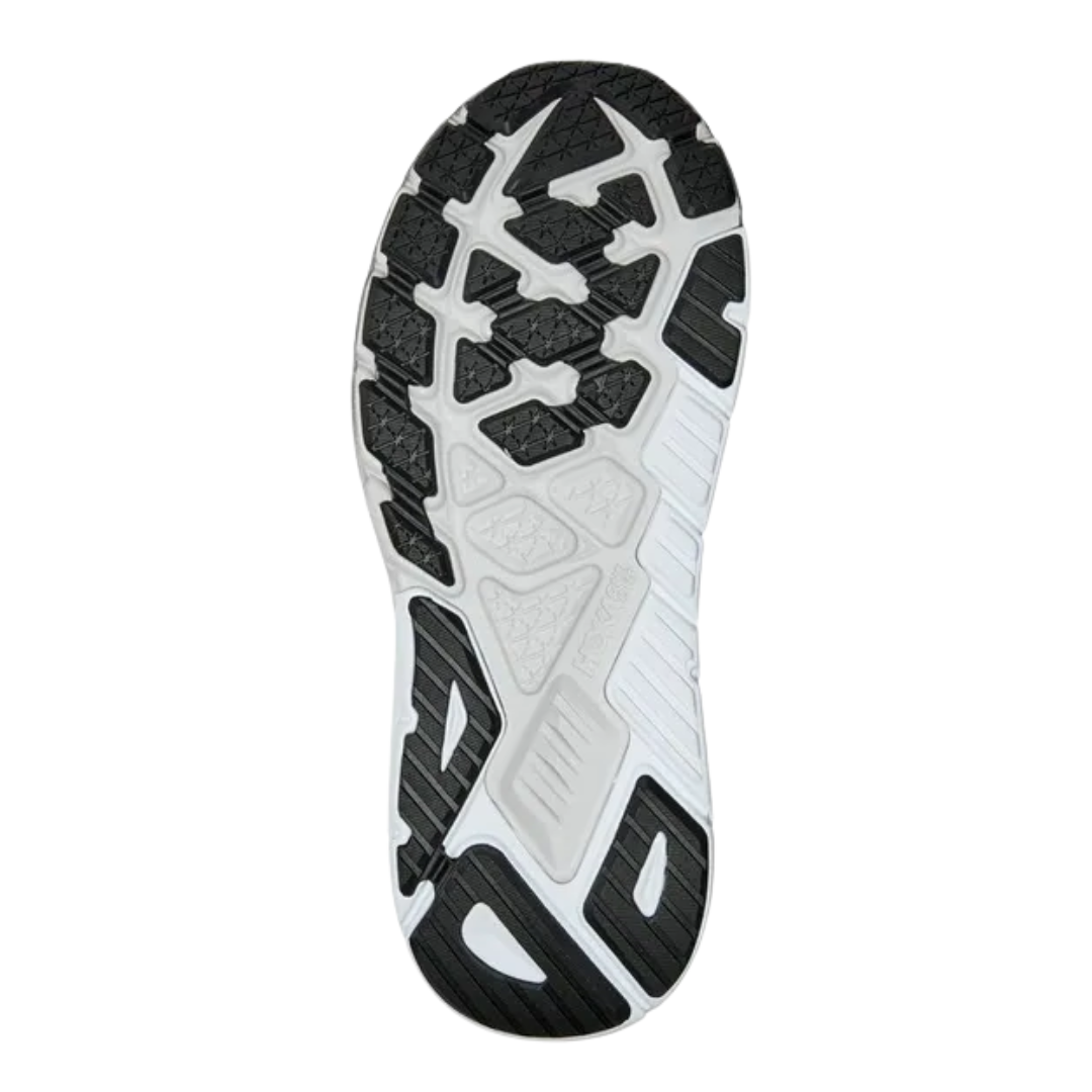 Bottom view of Men’s Arahi 6 running shoe in black and white – featuring durable rubber outsole with segmented crash pad for smooth heel-to-toe transition, flex grooves for natural foot movement, and multi-surface traction for versatile grip.