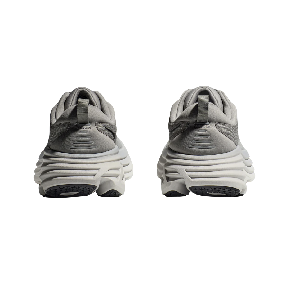 Back View of Men’s HOKA Rincon 3 Running Shoe in Black/White – featuring reinforced heel collar for stability, pull tab for easy on/off, and clean two-tone design for a modern look.