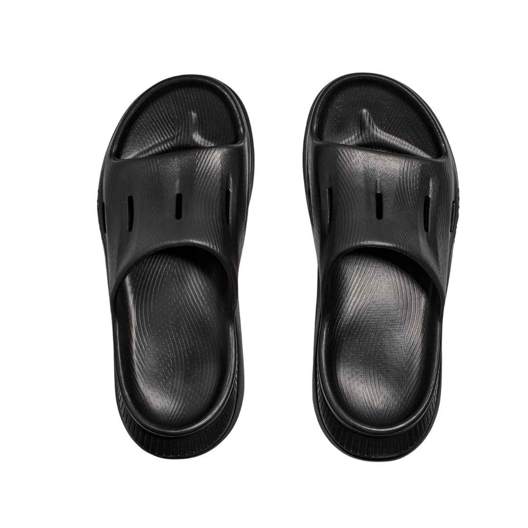 Top view of Men’s Ora Recovery Slide in black – featuring wide strap for secure fit, breathable open design for ventilation, and moisture-wicking materials to maintain dry, healthy feet.