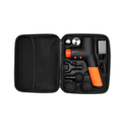 Top View of Jawku Muscle Blaster Mini in carrying case – featuring the massage gun with an orange and black design, six interchangeable massage head attachments, power adapter, and organized compartments for travel and storage.