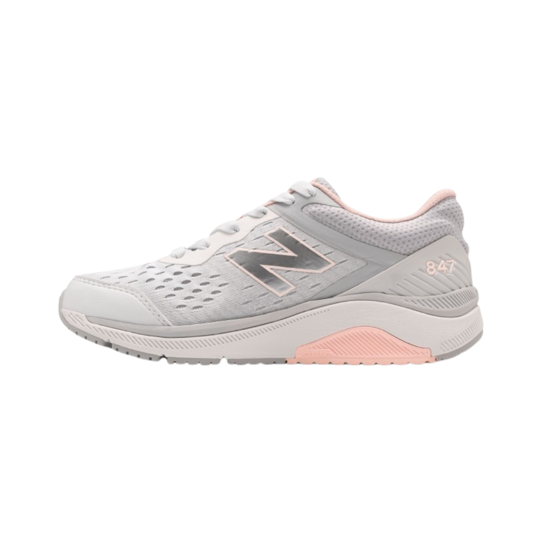 Side view of Women's New Balance 847v4 athletic shoe in arctic fox, silver mink, and peach soda – featuring a sleek synthetic and mesh upper, cushioned midsole for comfort, and supportive heel design for stability.