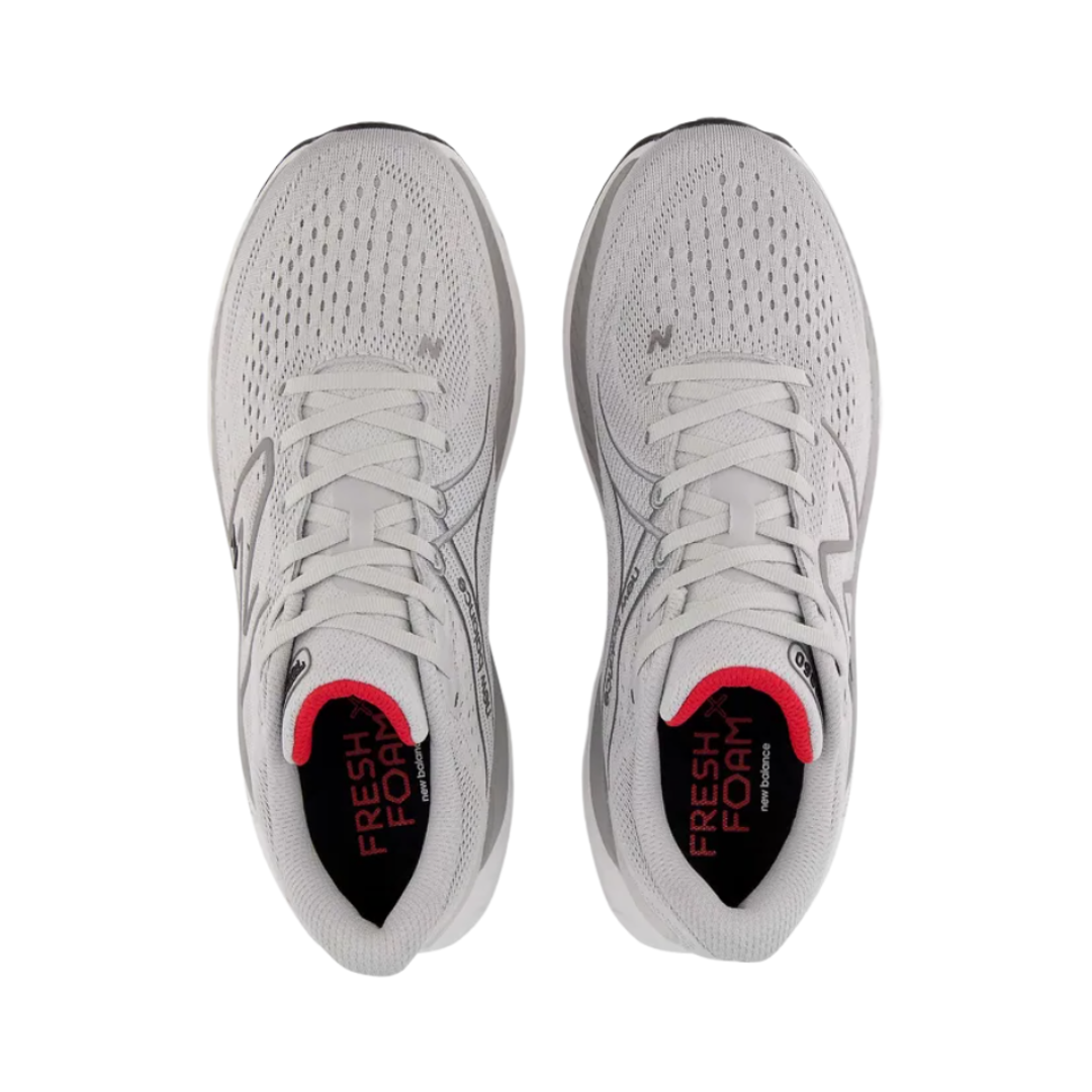Top View of Men’s New Balance Fresh Foam X 860v13 stability running shoe in light aluminum with true red and black – featuring a padded tongue and collar for ankle comfort, breathable engineered mesh upper for ventilation, and a secure lace-up design over a dual-density Fresh Foam X midsole for arch support and pronation control.
