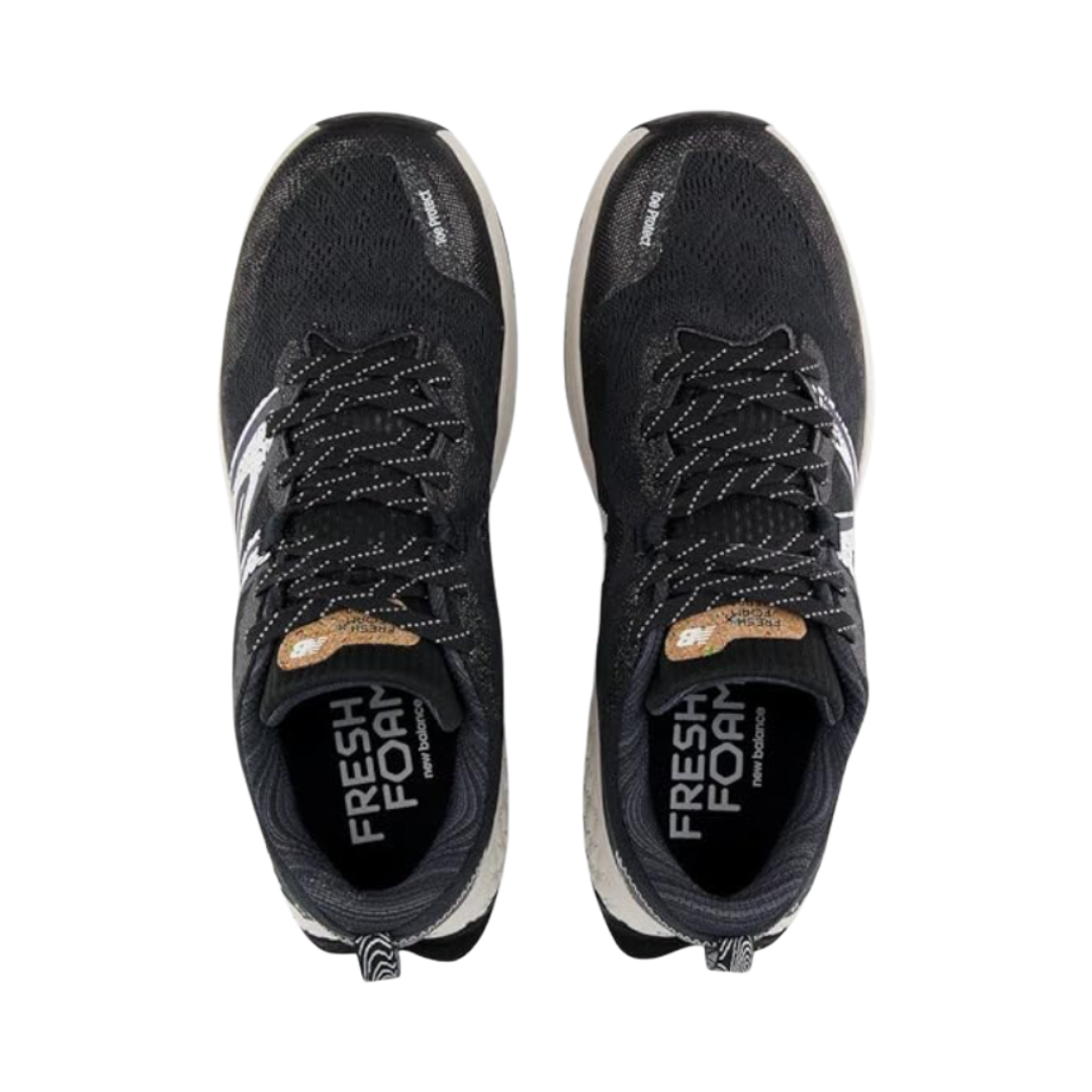 Top View of Men’s New Balance Fresh Foam X Hierro v7 trail running shoe in black reflection with white – featuring engineered mesh upper for breathability, Fresh Foam X midsole cushioning for plush comfort, and Vibram® outsole for rugged trail traction.