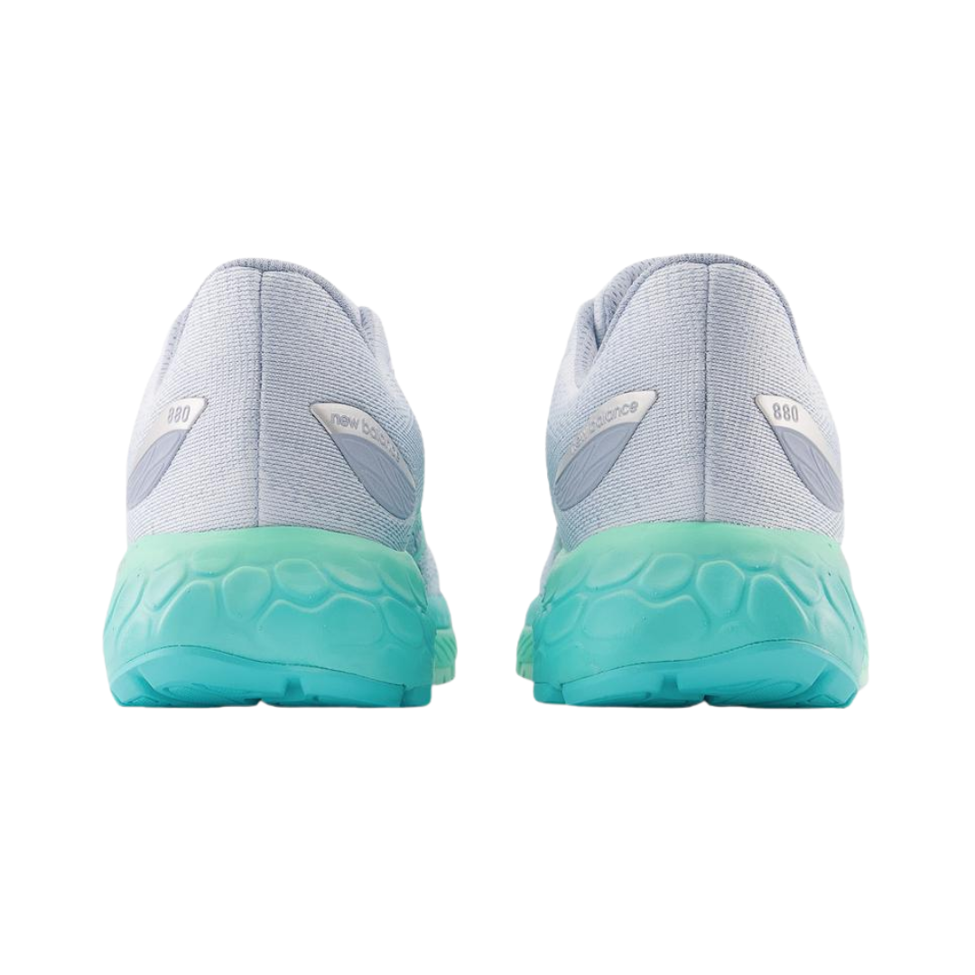 Heel view of Women’s New Balance Fresh Foam X 880v12 in Starlight/Bright Mint/Cyber Jade – featuring lightweight construction, supportive cushioning, and durable outsole suitable for running activities.