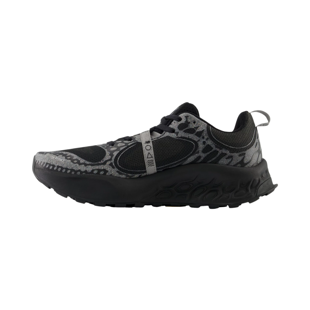 Side View of Men’s New Balance Fresh Foam X Hierro v8 trail running shoe in black with shadow grey – featuring rocker-style sole geometry for smoother heel-to-toe transitions, Fresh Foam cushioning for impact reduction, and medial support to help align the foot properly.