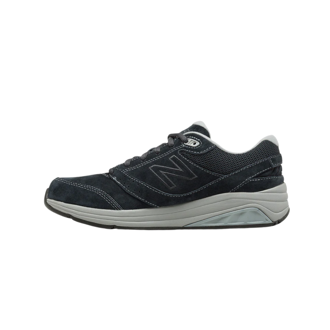 Side View of Women’s New Balance 928v3 Suede walking shoe in navy with grey – featuring motion control midsole, suede and mesh upper for breathability, and ENCAP cushioning for support.