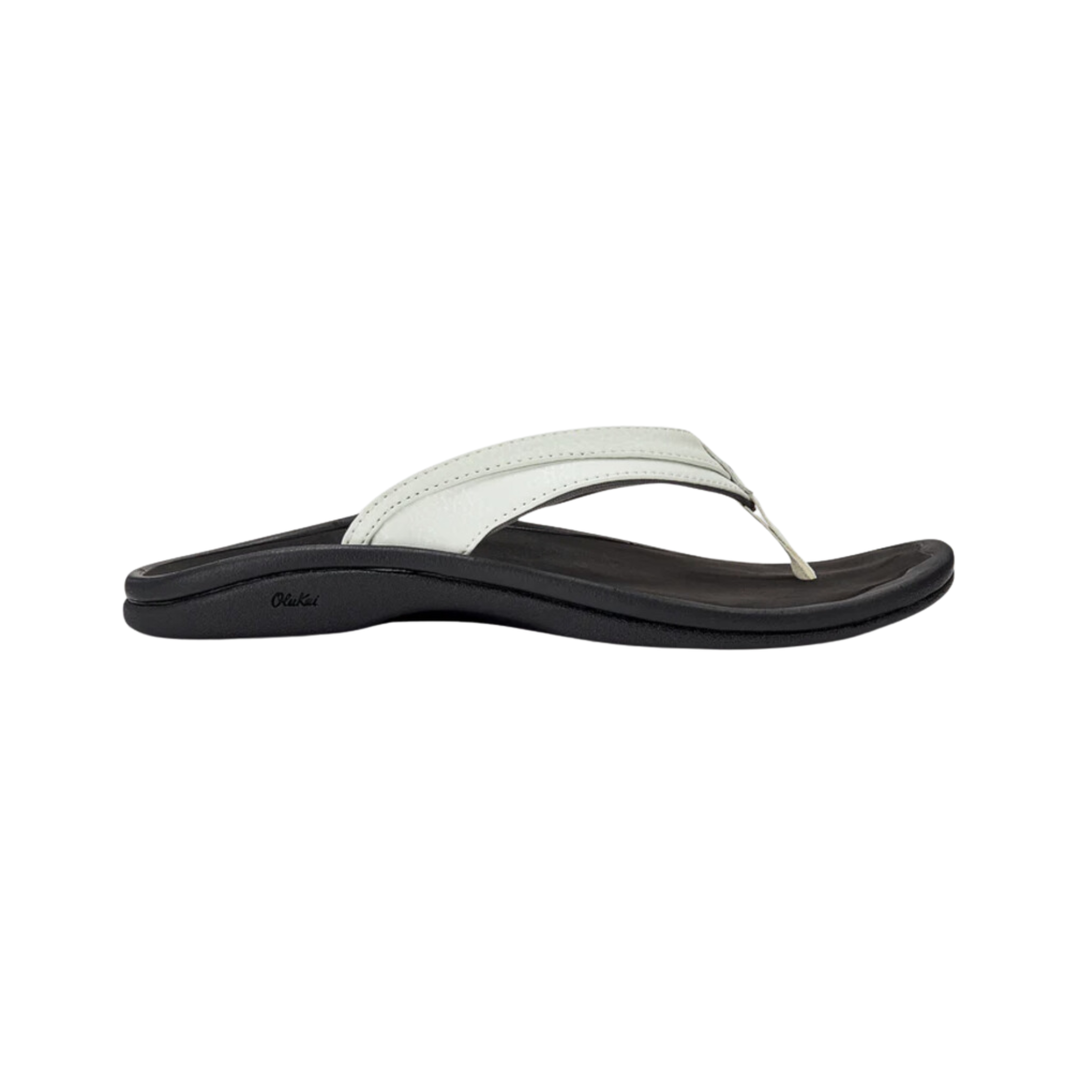Side View of Women’s Olukai Ohana sandal in white and black – featuring a lightweight EVA midsole, water-resistant construction, and non-marking rubber outsole with enhanced traction.