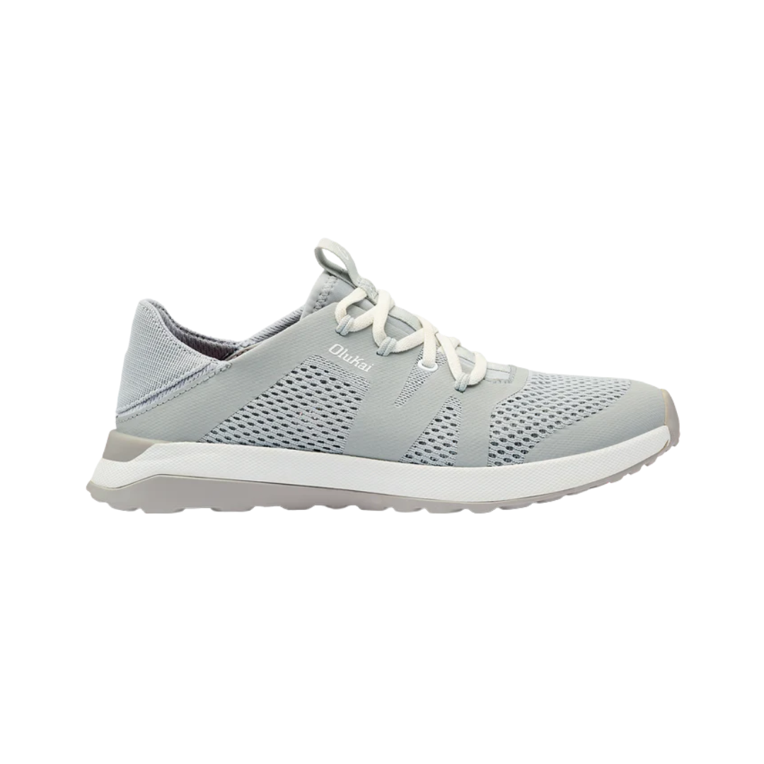 Side view of Women’s Olukai Huia slip-on sneaker in pale grey – featuring breathable mesh upper, anatomical footbed, and cushioned EVA midsole with traction pods.