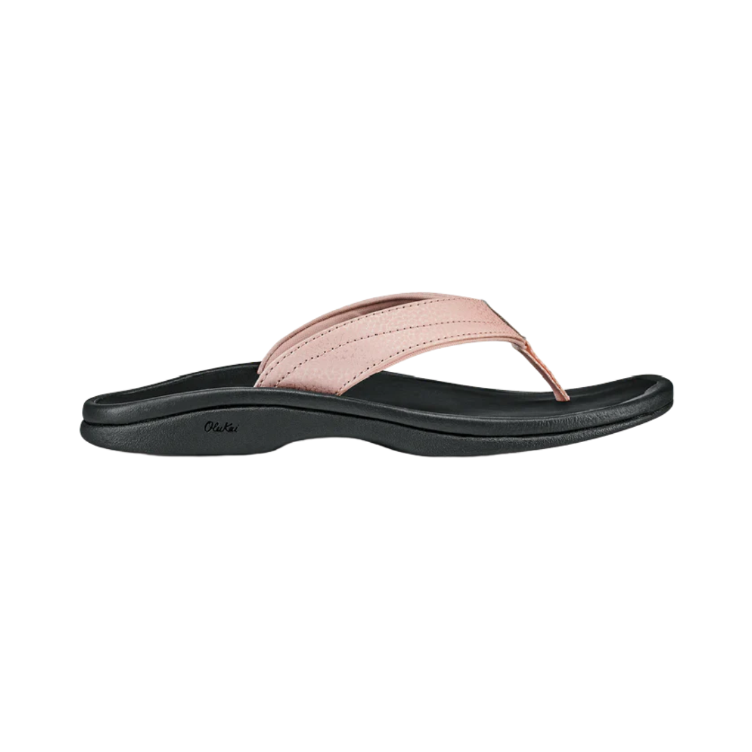 Side View of Women’s Olukai Ohana sandal in petal pink and black – featuring a lightweight EVA midsole, water-resistant construction, and non-marking rubber outsole with enhanced traction.