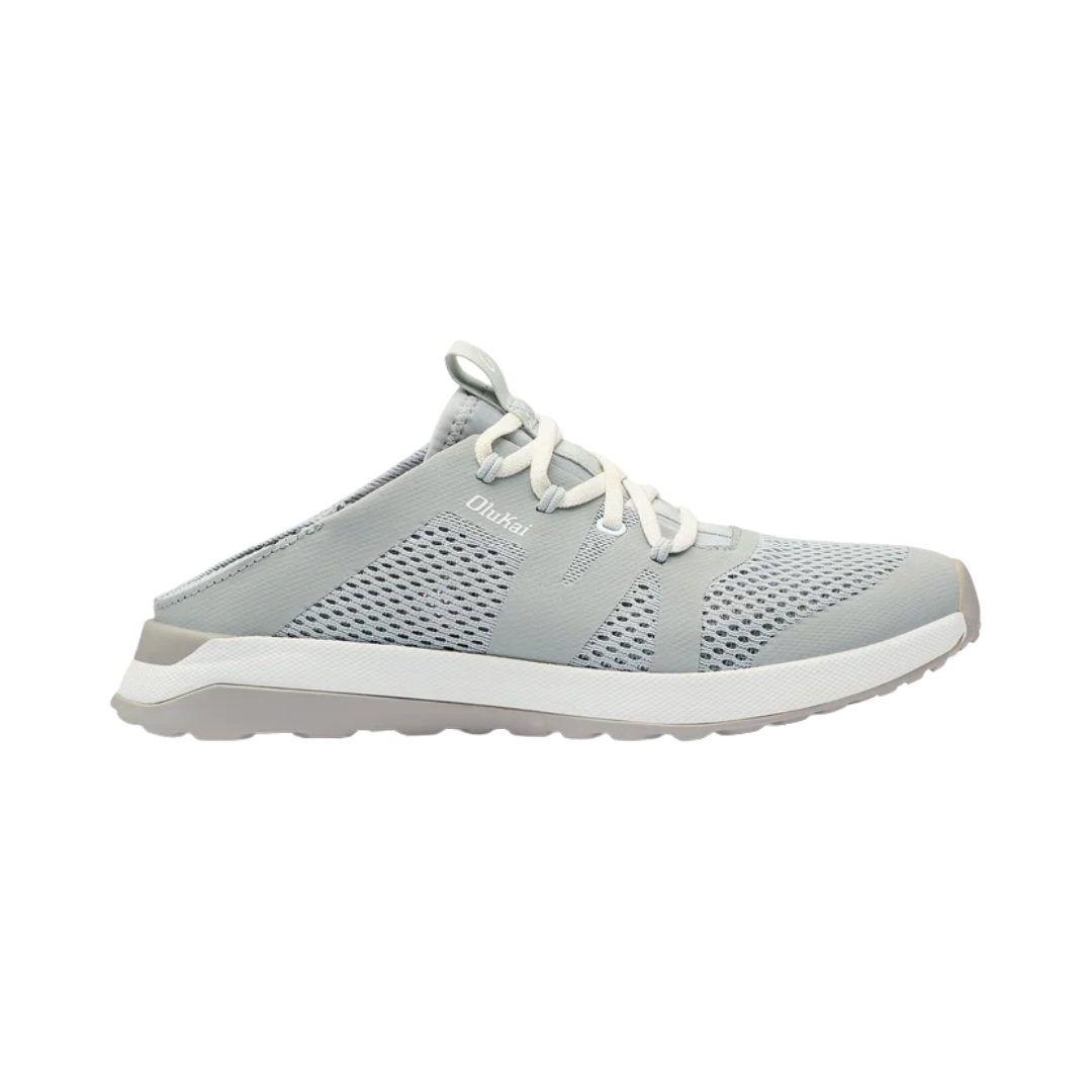 Side View of Women’s Olukai Huia slip-on sneaker in pale grey – featuring a breathable mesh upper, lightweight EVA midsole, and non-marking Wet Grip Rubber outsole for traction.