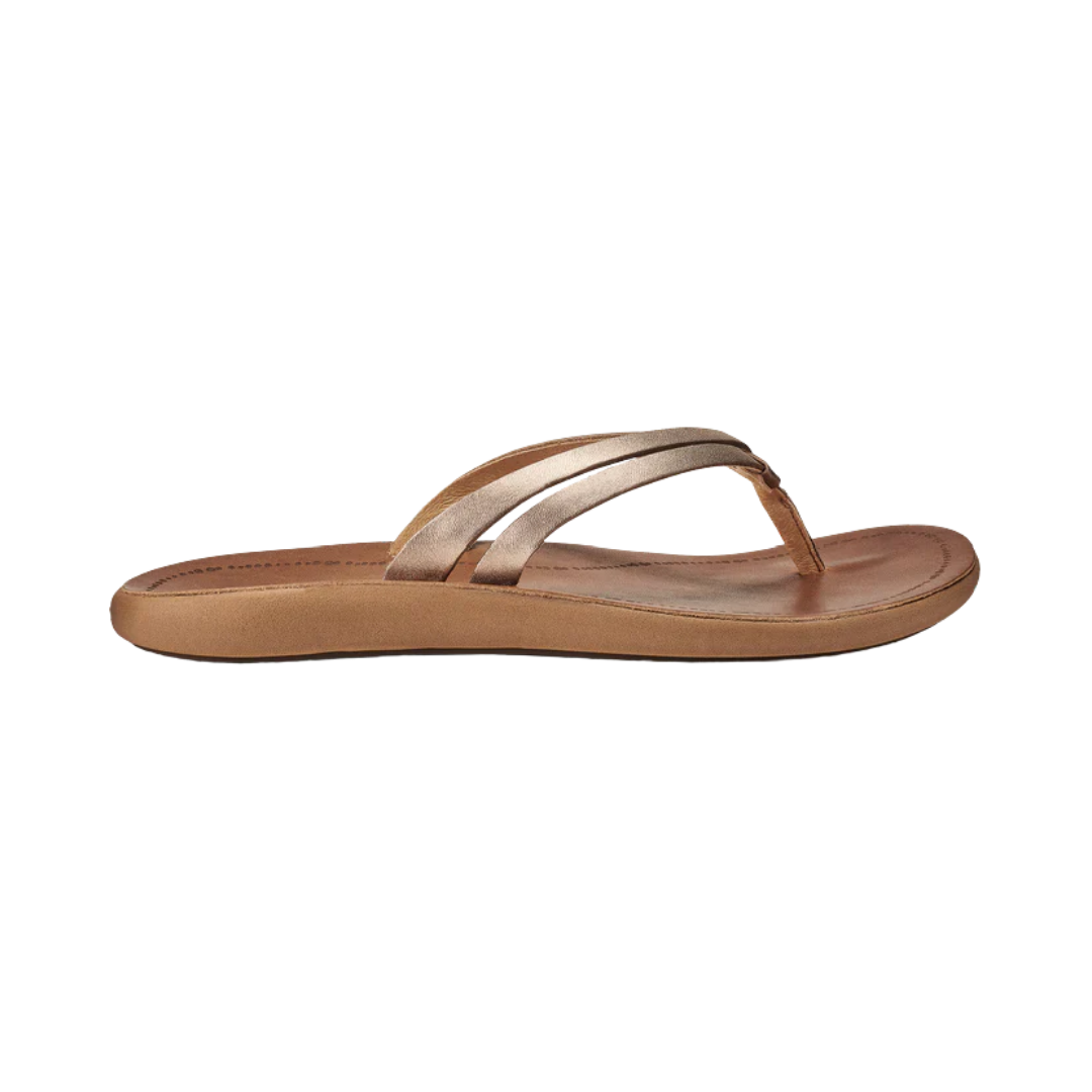 Side View of Women’s Olukai Kapehe Luana sandal in bubbly sahara – featuring a premium leather upper, cushioned footbed for all-day comfort, and a durable rubber outsole for traction.