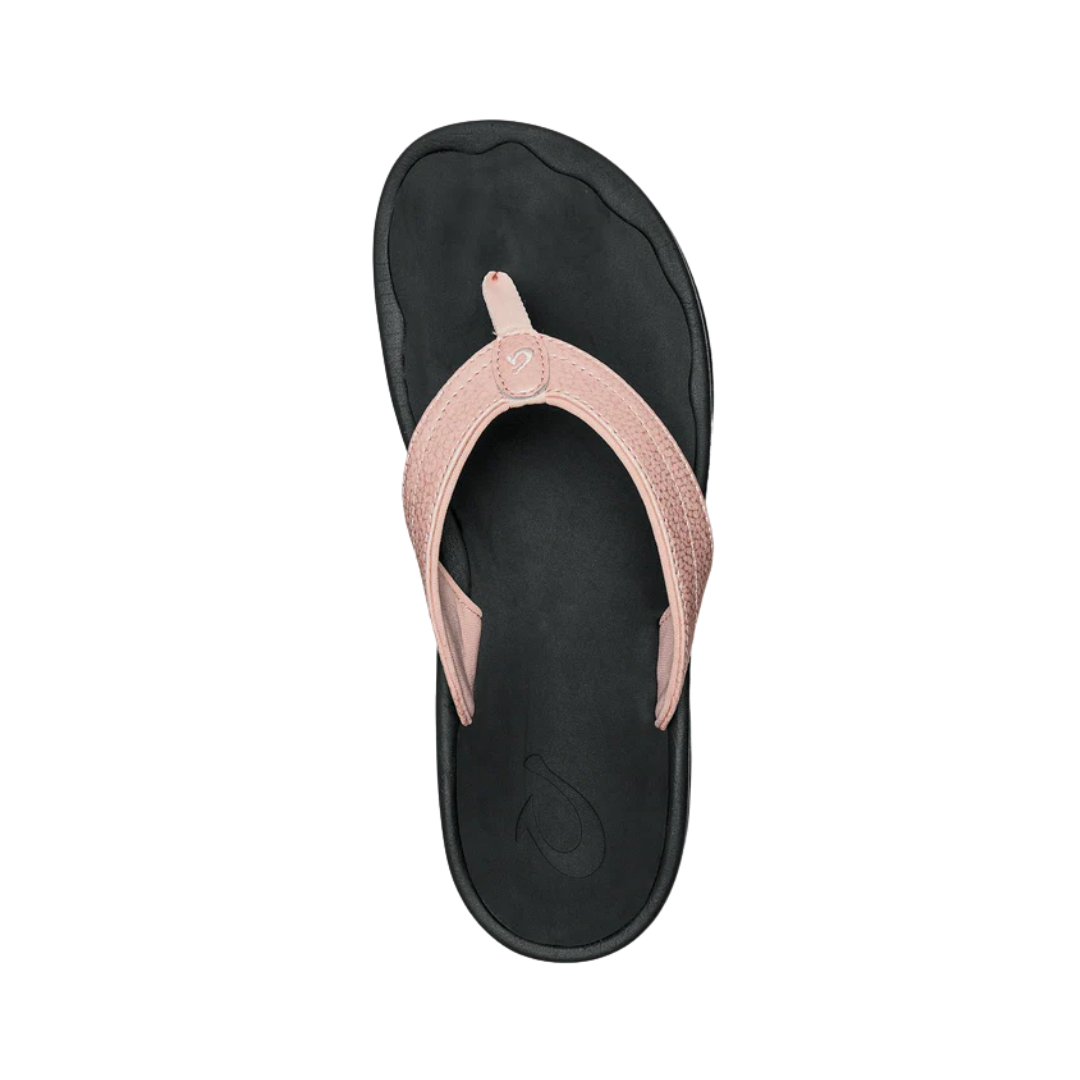 Top View of Women’s Olukai Ohana flip-flop sandal in petal pink and black – featuring a contoured EVA footbed, quick-drying straps, and an anatomically correct arch for all-day support.