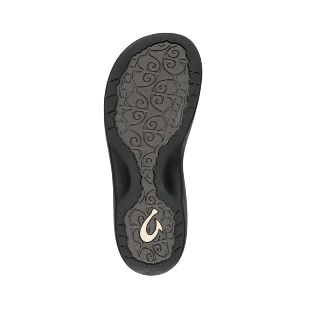 Bottom View of Women’s Olukai Ohana flip-flop sandal in white and black – featuring a durable rubber outsole, coral reef-inspired tread design, and slip-resistant traction for versatile wear.

