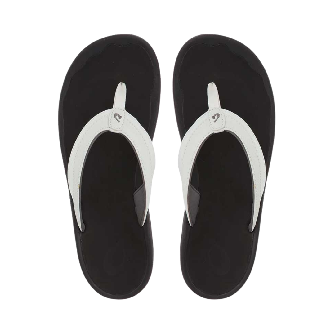 Top View of Women’s Olukai Ohana flip-flop sandal in white and black – featuring a contoured EVA footbed, quick-drying straps, and an anatomically correct arch for all-day support.