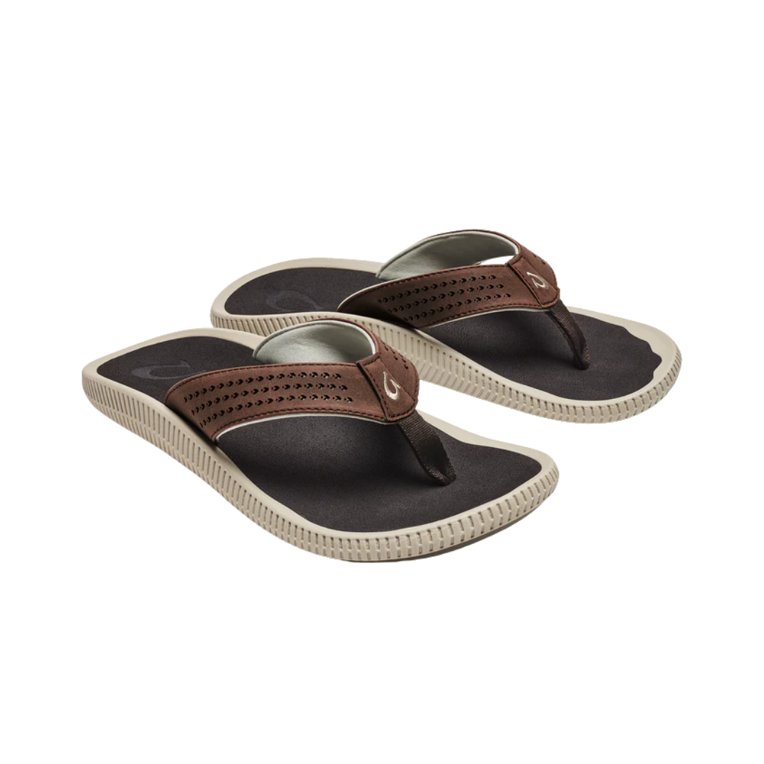 Side View of Men’s Olukai Ulele sandal in dark wood – featuring a water-resistant synthetic upper, soft microfiber lining for comfort, and a non-marking wet-grip rubber outsole.