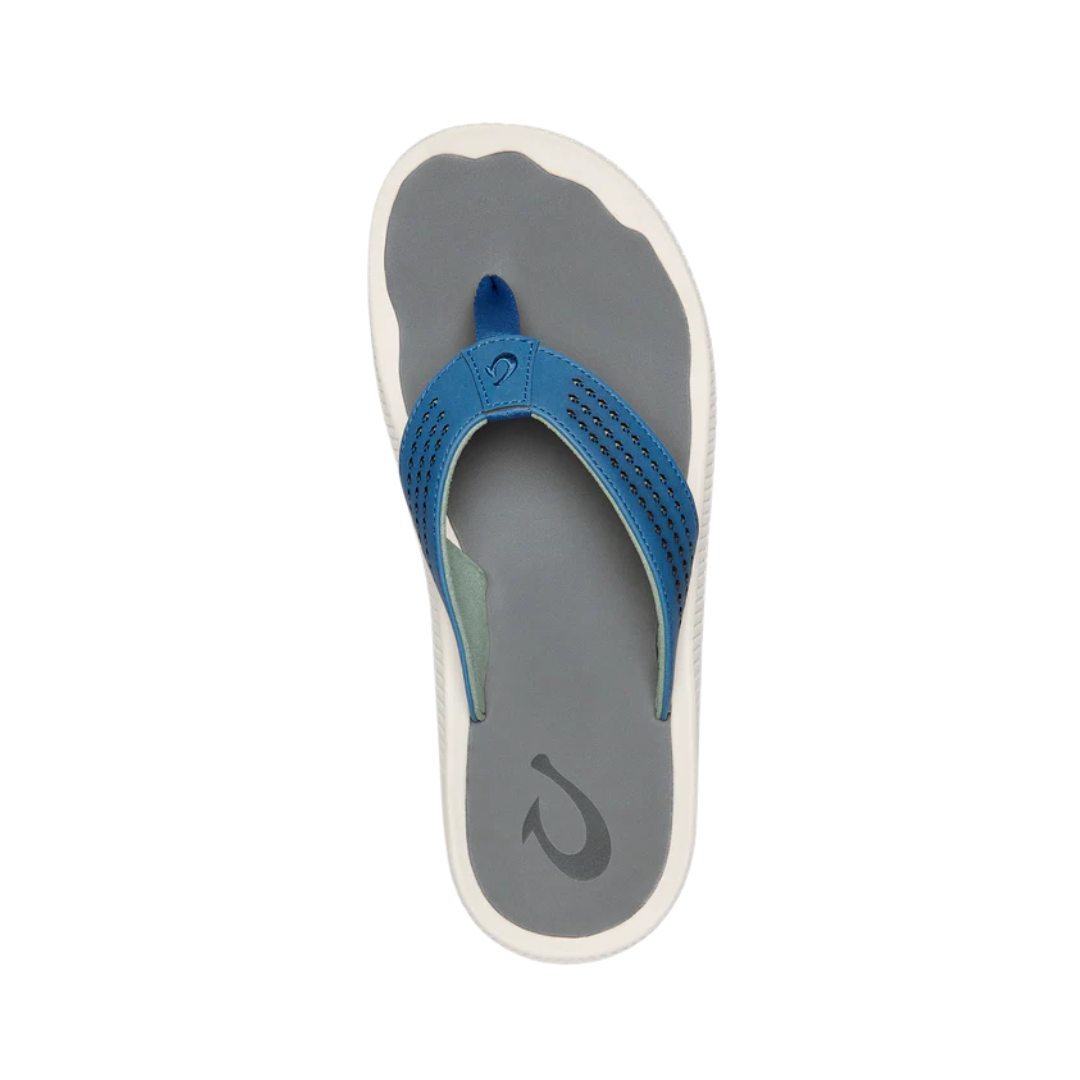 Top View of Men’s Olukai Ulele sandal in slate blue and charcoal – featuring water-resistant synthetic straps, soft quick-drying lining, and a cushioned EVA footbed with excellent traction.