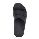 Top view of Unisex OOFOS Ooahh Slide Sandal in black – featuring a wide, seamless synthetic strap, anatomically molded footbed, subtle textured surface for grip, and a clean, minimal look in solid black.