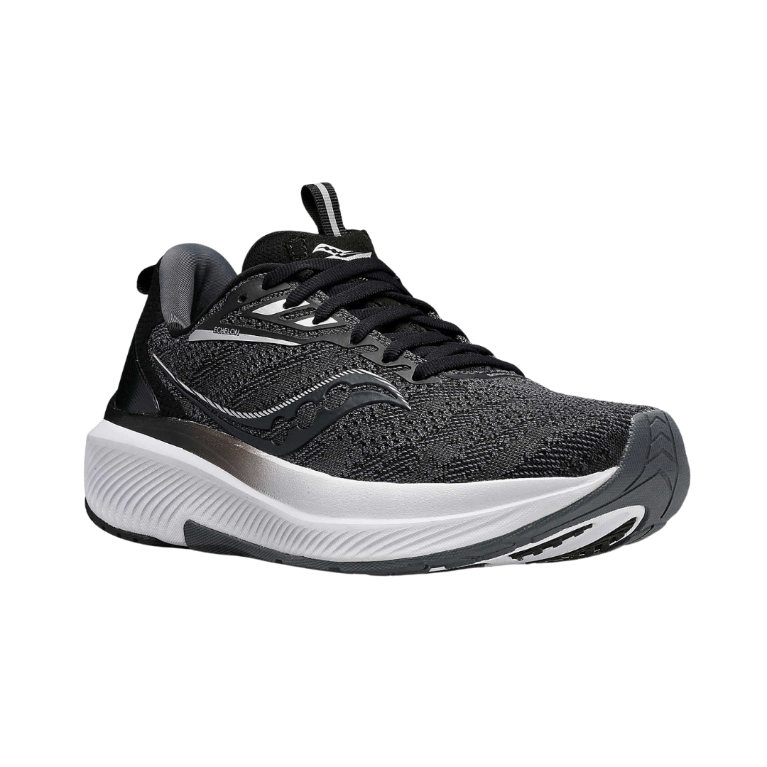 Angled view of Women’s Saucony Echelon 9 in Black/White – featuring a breathable black upper, responsive PWRRUN midsole, wide and stable platform, and classic monochrome styling built for all-day comfort and neutral support.